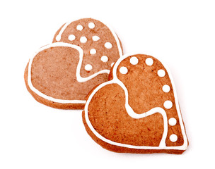 two cookies in the shape of  heart on  white background 