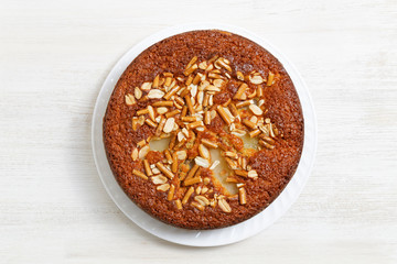 Pie with pears, peanuts and cookies-sticks