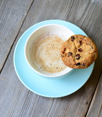 Cappuccino on wooden background