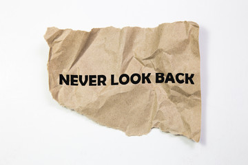 Never Look Back written under torn paper.