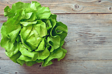 Green salad on wooden background