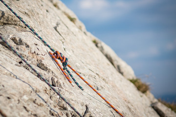 Climbing rope knot on stone wall