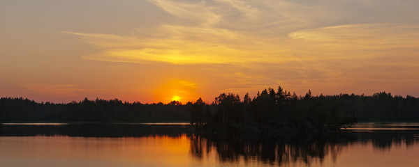 sunset on forest lake