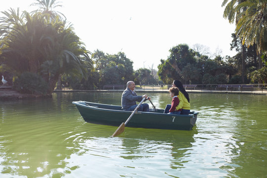 Family in rowing boat on lake