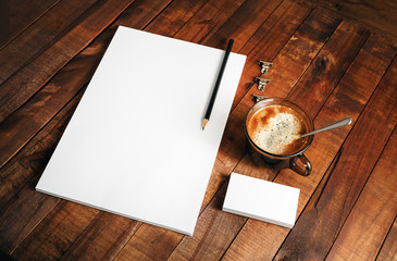 Photo of blank corporate identity template. Photo of blank ID. Blank letterhead, business cards, coffee cup and pencil. Mock-up for design presentations and portfolios.