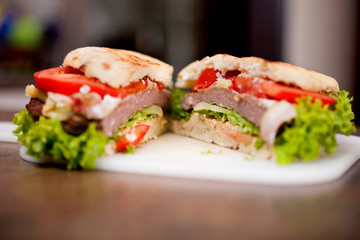 Closeup of homemade hamburger with fresh vegetables