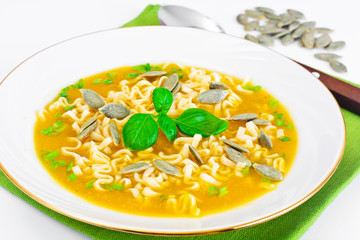 Pumpkin Soup with Noodles, Greens and Pumpkin Seeds