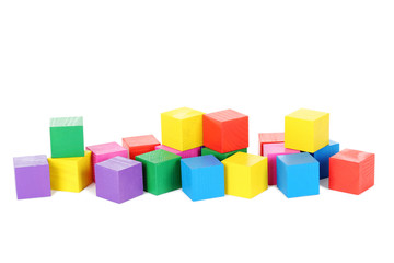 Colorful wooden toy cubes isolated on a white