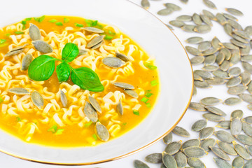 Pumpkin Soup with Noodles, Greens and Pumpkin Seeds