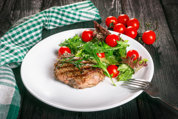 steak and salad on a plate