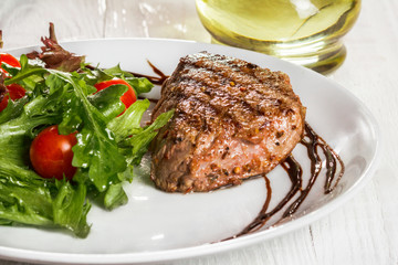 steak and salad on a plate