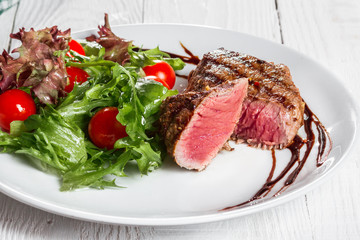 steak and salad on a plate