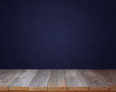 Empty Wooden Table Against A Blue Wall.