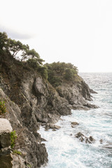 Small storm near the rocky shore of the Ligurian seafront.