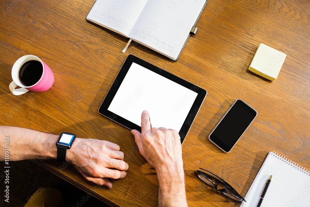 Poster businessman using a tablet computer