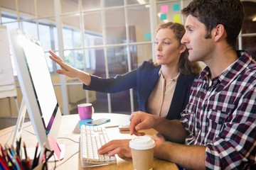 Colleagues using a computer