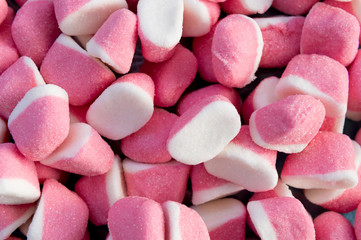 Collection of white and pink gummy candies