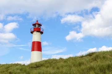 Fototapeta na wymiar Lighthouse on the Dune Lighthouse List East on a dune of the island Sylt, Germany, North Sea