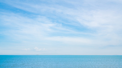 Blue sea on sunny, cloudy sky background
