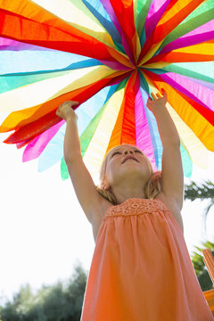 Girl putting up decoration
