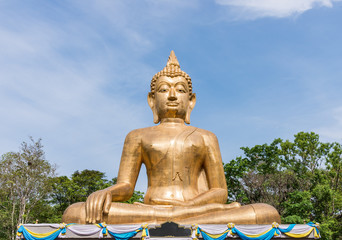 Large Buddha statue with golden tile