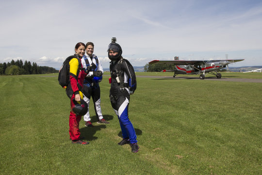 Portrait of skydiving team preparing to fly,  Buttwil, Luzern, Switzerland