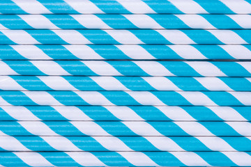 Pattern of blue striped paper straws.
