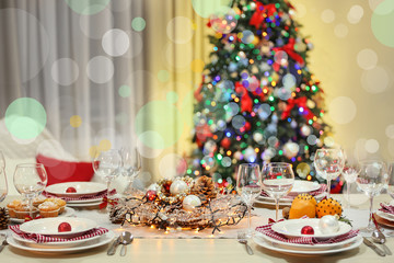 Christmas table setting with holiday decorations background