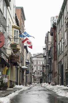 Old town street with Canadian and Quebec flags, Quebec City, Quebec, Canada