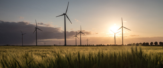 wind turbine farm sundown - Powered by Adobe