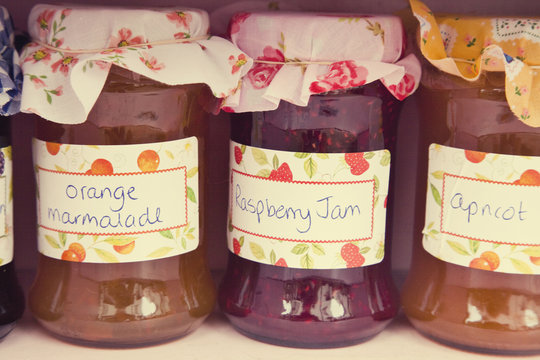 Close up of jars of homemade jam and marmalade