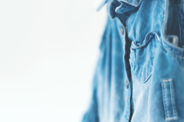 Baby girl clothes, denim dress with heart shaped pocket on clothes, selective focus