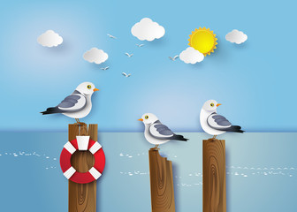 Fototapeta premium Seagull standing on a wooden post