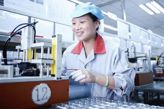 Worker at e-cigarettes battery factory, Guangdong, China