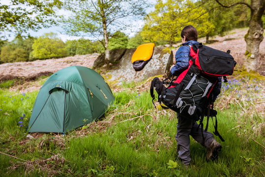 Young woman carrying camping gear, Pateley Bridge, Nidderdale, Yorkshire Dales