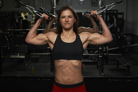 Young woman, lifting weights