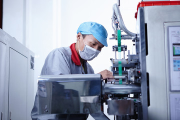 Worker at e-cigarettes battery factory, Guangdong, China
