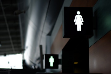 entrance to the male and female toilet. Sign in airport