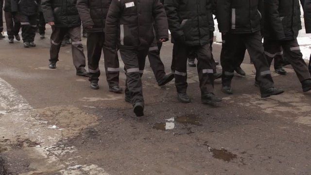 Group of prisoners walking on a road Russia