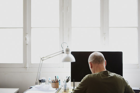 Mature man working in creative studio
