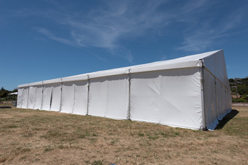 Large white tent for entertaining in field