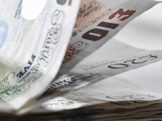 Close up detail of a stack of British banknotes