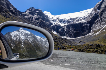Beautiful mountains seen on the rearview mirror.
Road to Milford Sound in New Zealand