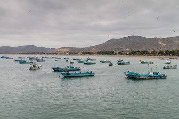 Fototapeta na wymiar PUERTO LOPEZ, ECUADOR - JULY 2, 2015: Fishing boats in a port of Puerto Lopez
