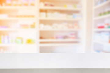 pharmacy shelves filled with medication blur background