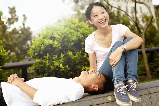 Tourist couple on wall, The Bund, Shanghai, China
