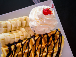 waffles with chocolate sauce and ice cream