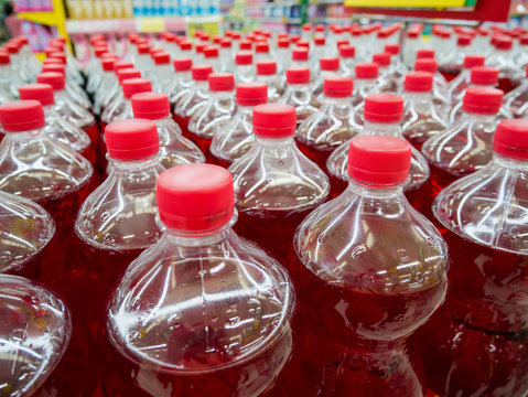row of carbonated soft drink bottles