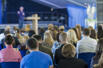 Obraz premium Business Conference Concept and Ideas. Lecturer Speaking In front of the Group of People