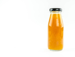Fototapeta na wymiar Orange juice in a bottle on a white background.